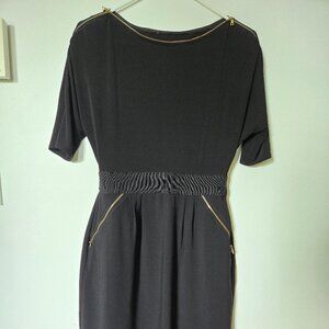 Very cute waist - fit black dress with gold zippers; size M